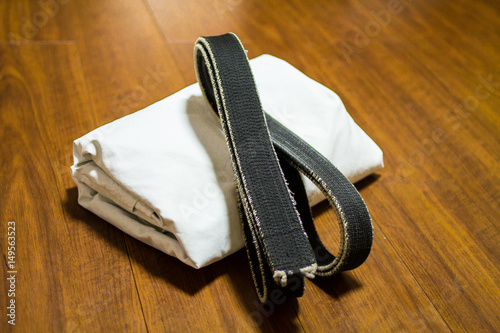 Obraz na plátně Black belt and Gi for martial arts ( Karate, Judo, Jiu-Jitsu, Kenpo, Taekwondo,