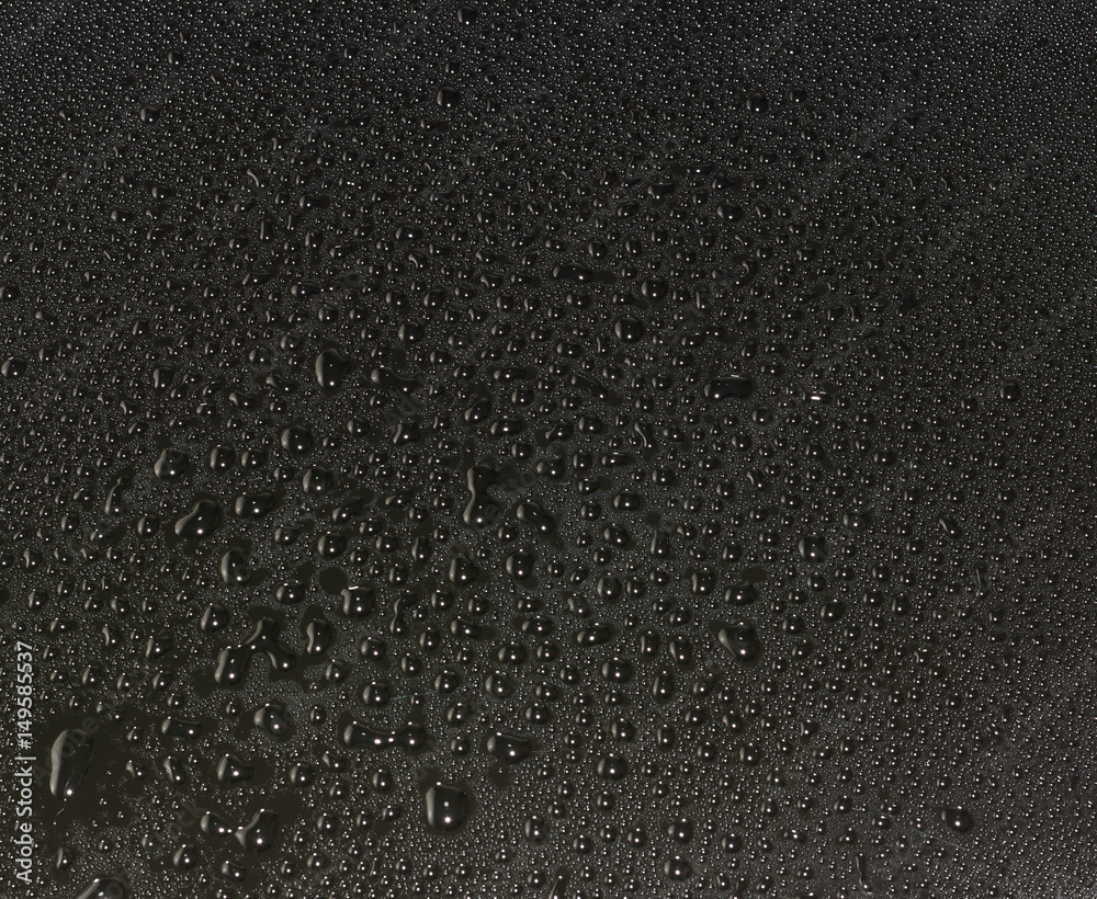 Hintergrund Wasser und Tropfen auf schwarzer Platte