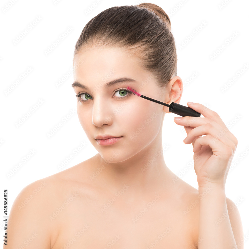 Eye make up apply. Mascara applying closeup, long lashes. Mascara brush. Portrait of beautiful young brunette woman with perfect fresh clean face skin. Eyelashes extensions. Make-up for green eyes Eye make up apply. Mascara applying closeup, long lashes. Mascara brush. Portrait of beautiful young brunette woman with perfect fresh clean face skin. Eyelashes extensions. Make-up for green eyes