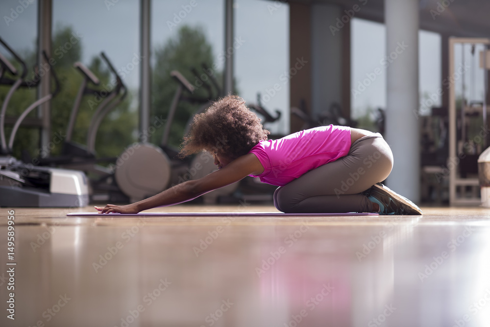 african american woman exercise yoga in gym
