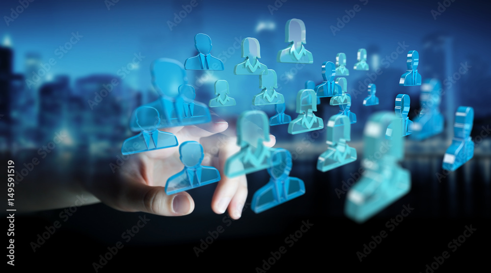 Businessman holding 3D rendering group of blue people Businessman holding 3D rendering group of blue people