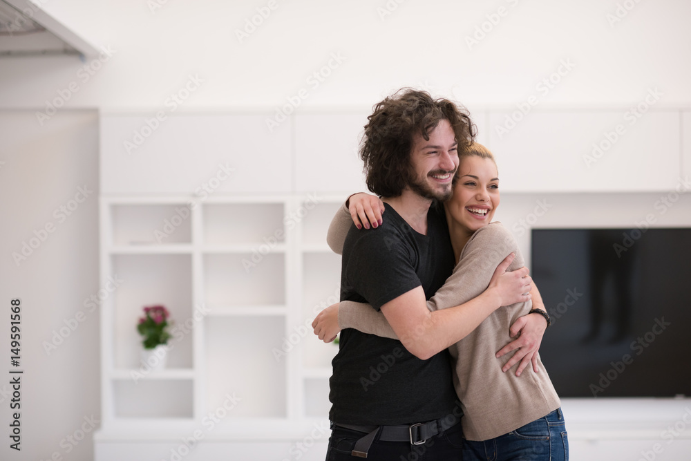 couple hugging in their new home couple hugging in their new home
