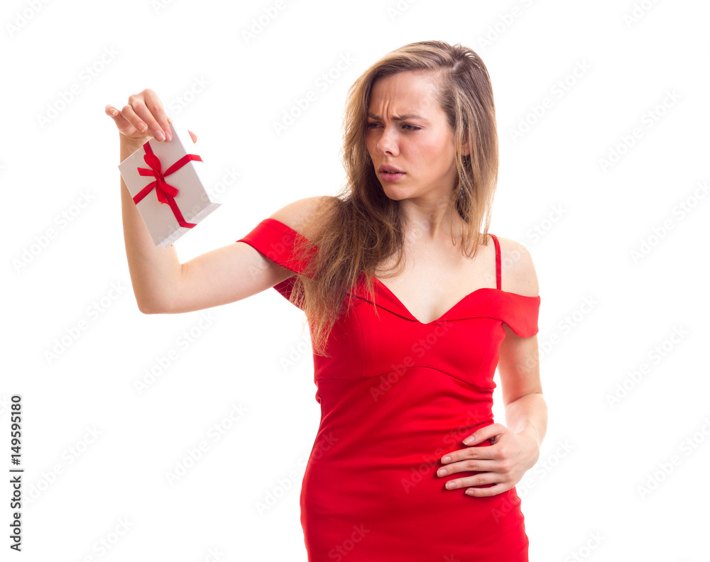 Young woman in red dress holding present Young woman in red dress holding present