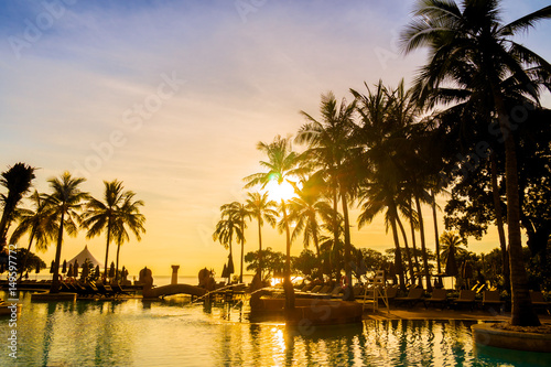 Silhouette coconut palm tree around swimming pool © siraphol