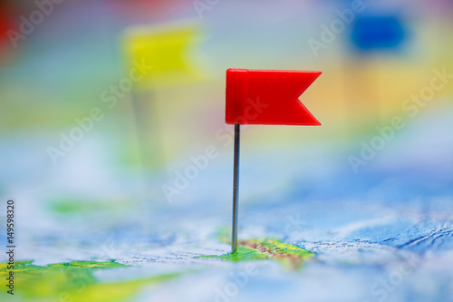 Travel concept with flag pushpins and world map