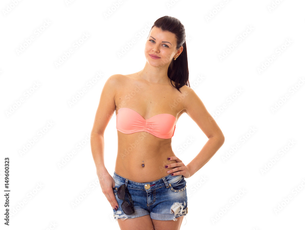 Woman in swimming suit and shorts Woman in swimming suit and shorts