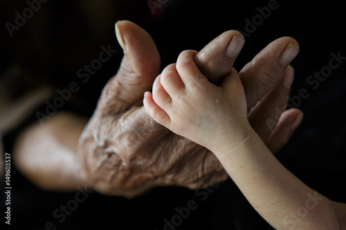 Grandmother holding Grandchild (Soft focus and blurry)