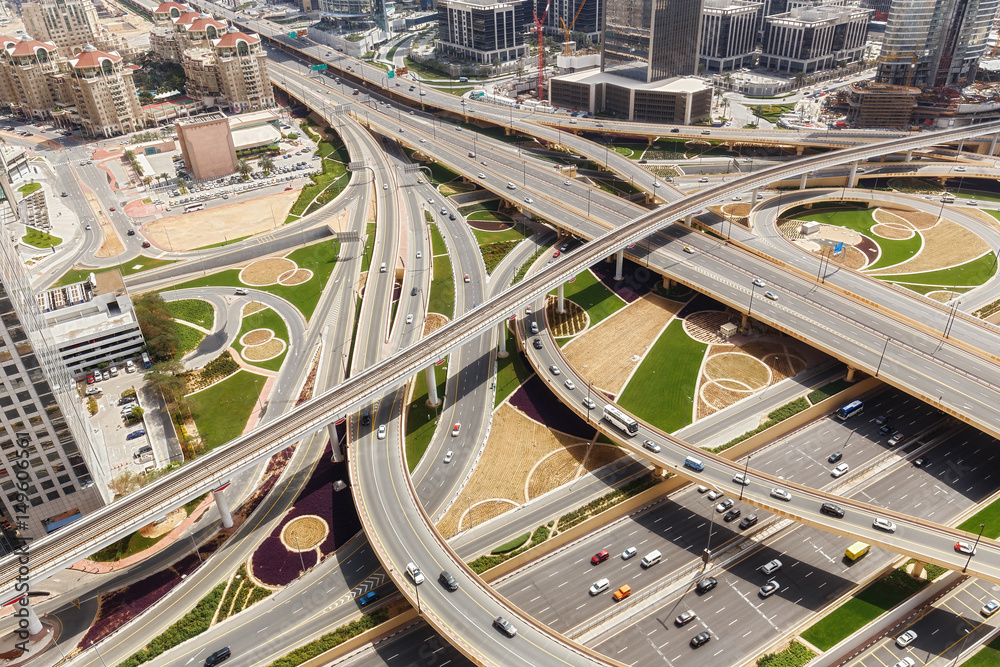 Scenic aerial view of famous highway intersection in Dubai, UAE, at day. Transportation and travel background.