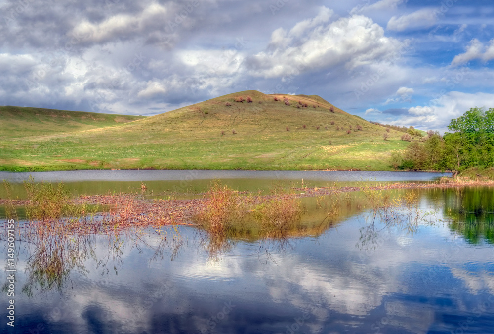 Mountain, river, sky. Russian steppe.