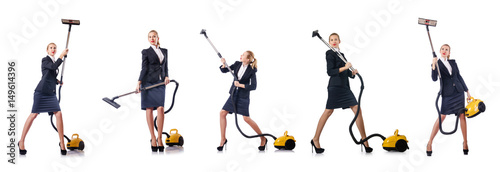 Businesswoman cleaning with vacuum cleaner on white