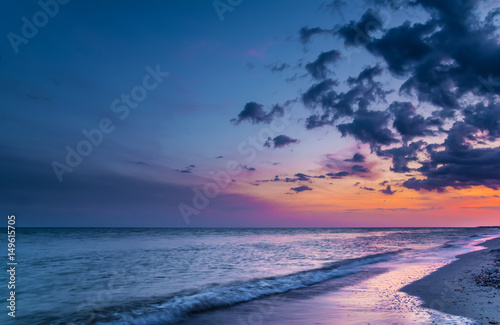 Beautiful sunset on sea beach photo