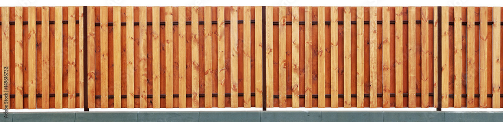 New modern  yellow wooden rural fence from vanished vertical pine planks.