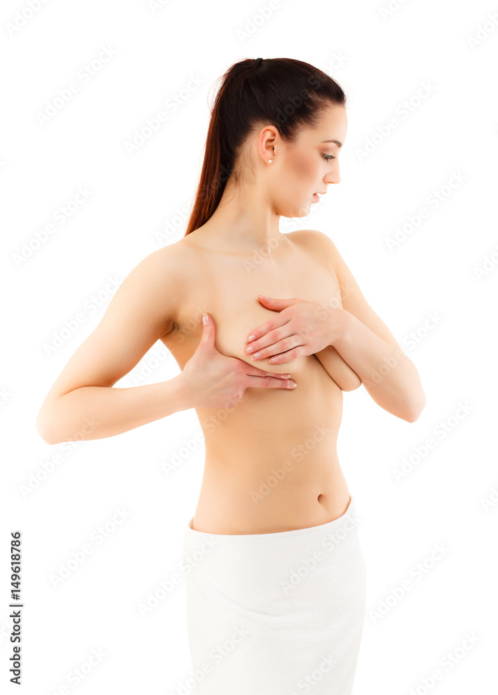 Fototapeta premium Woman examining her breast isolated on white background