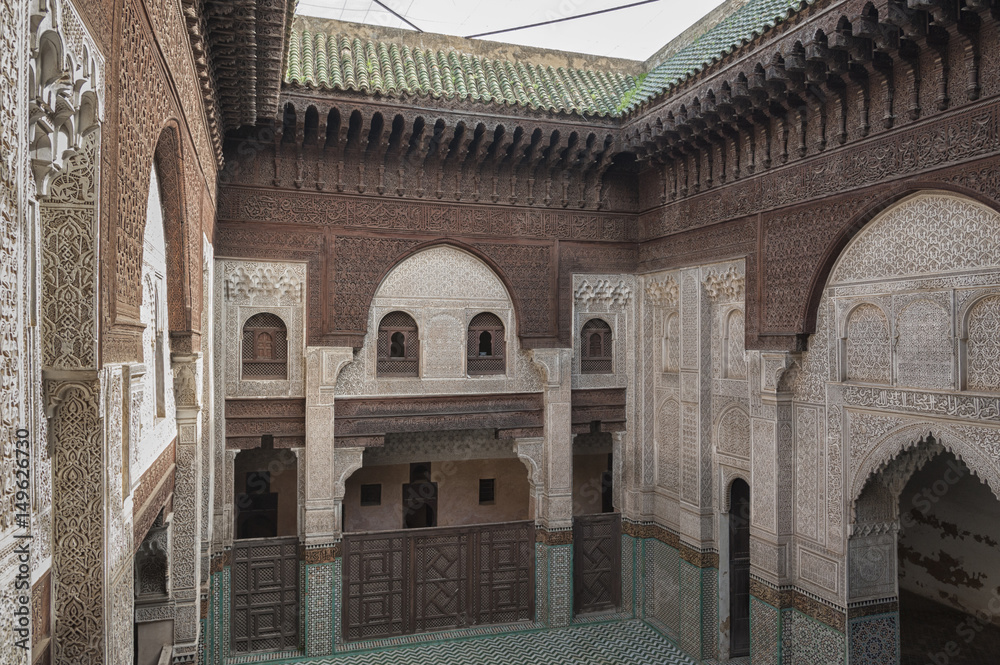 MEKNES, MOROCCO - FEBRUARY 18, 2017: Madrasa Bou Inania interior in Meknes, Morocco. Madrasa Bou Inania is acknowledged as an excellent example of Marinid architecture in Meknes