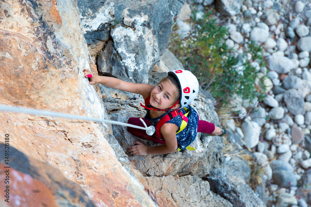 Little Girl doing Rock Climbing Training on vertical Wall Stock Photo ...