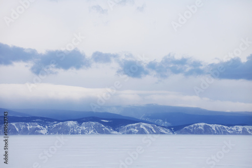 Winter landscape. Baikal lake. Snowy mountains