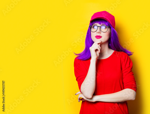 young woman in cap and glasses photo