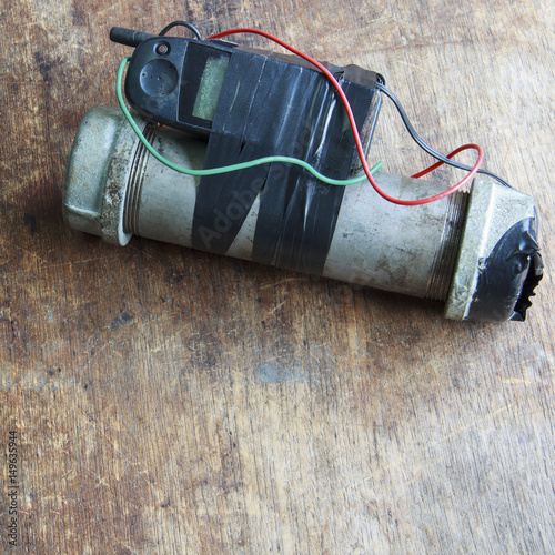 Steel pipe explosive (IED) is ignited by cell phone.