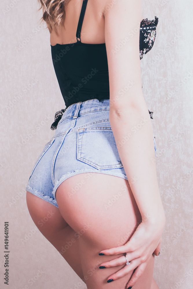 Sexy girl in corset and denim shorts, beautiful ass, view from the back  Stock Photo | Adobe Stock