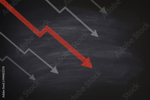 Decline in stocks on blackboard
