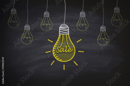 Sale light bulbs on the blackboard