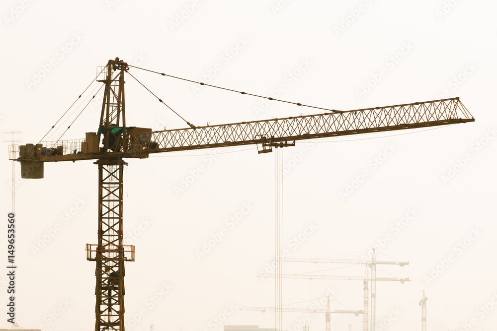 Heavy power crane working a construction. Heavy power crane working a construction.