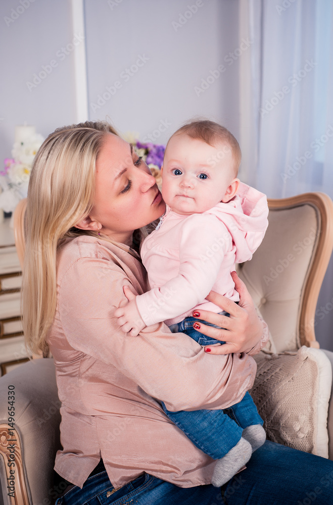 A little baby girl is photographed in a beautiful outfit for 6 months A little baby girl is photographed in a beautiful outfit for 6 months