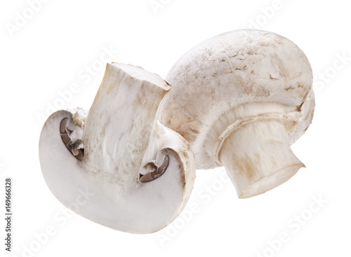 Sliced and whole mushrooms champignon isolated on white background