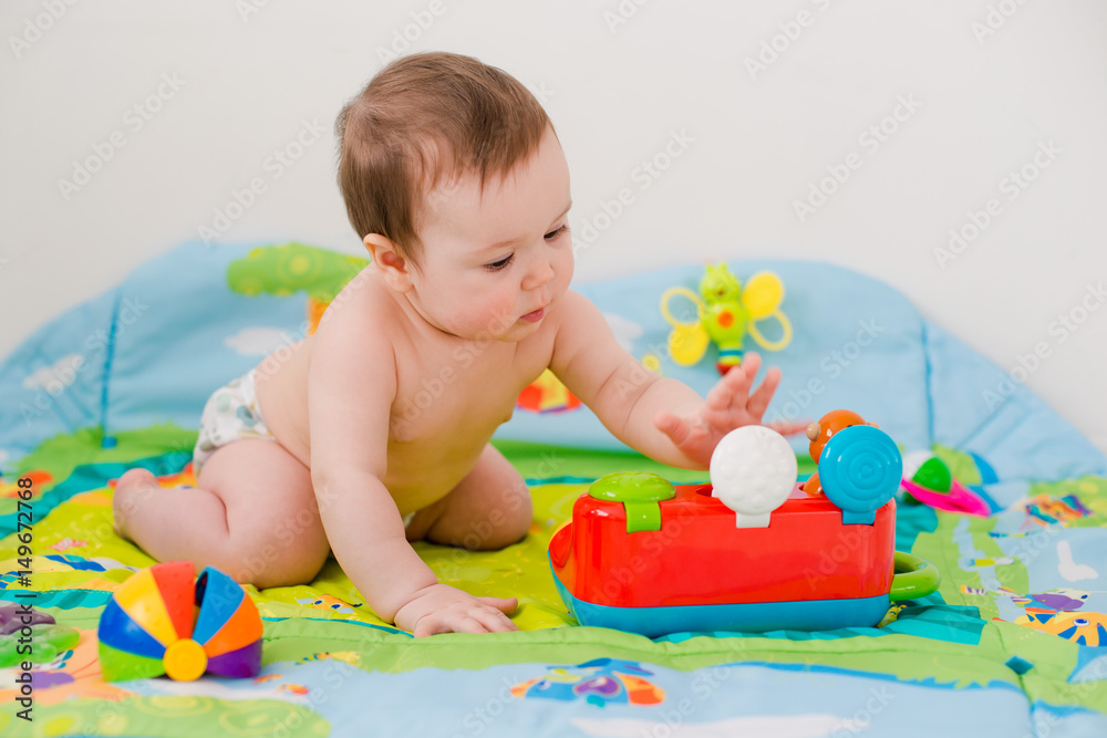 baby playing with educational toys lying baby playing with educational toys lying