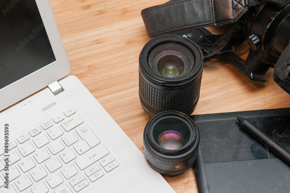 Professional photography editing equipment with camera and laptop