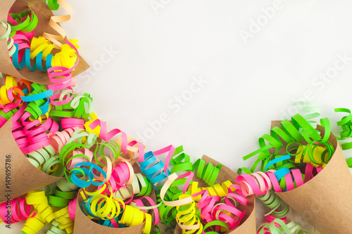 Party, celebration, birthday or carnival background with colorful streamers, copy space