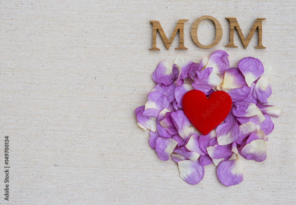 Mother's day concept background, mom wooden letter and red heart on rose with space on canvas background