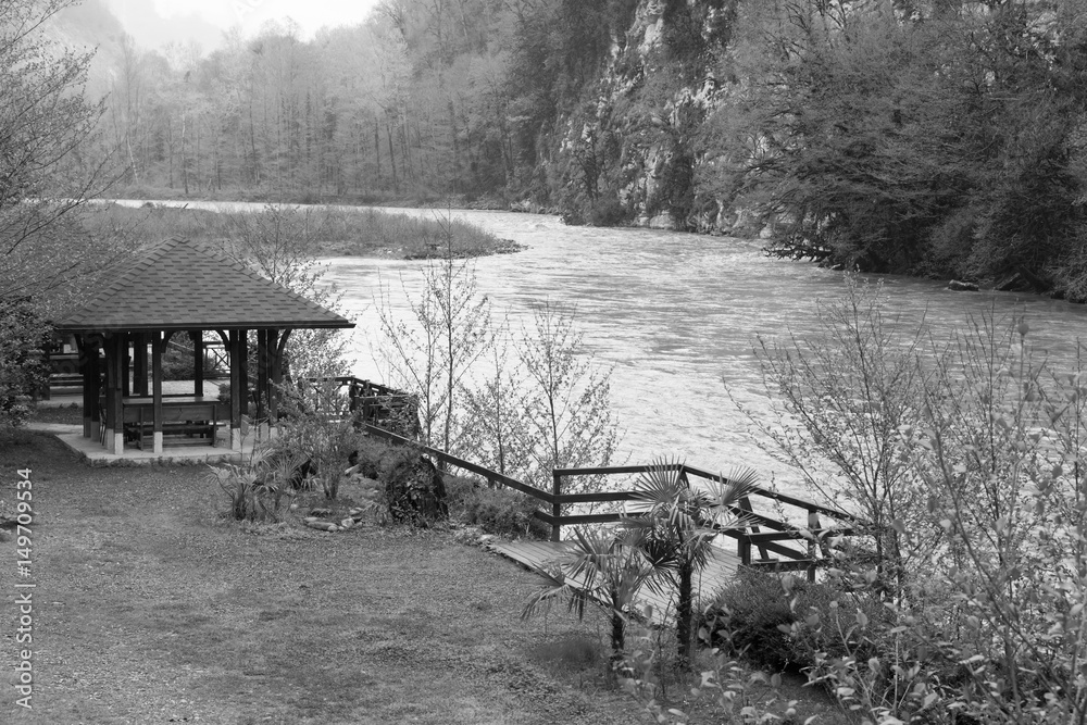 custom made wallpaper toronto digitalSpring landscape on the banks of the river Mzymta with gazebo and vegetation - black and white