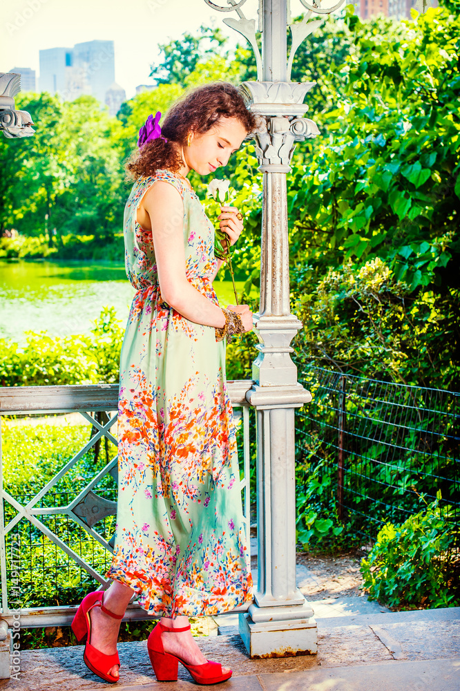 Young American missing you with white rose, lonely at Central Park, New York Young American missing you with white rose, lonely at Central Park, New York