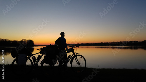 Obraz na płótnie Mazury, Poland. Sunset lake landscape with the bicycles w salonie