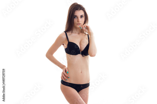 charming young girl with beautiful body stands in black underwear © ponomarencko