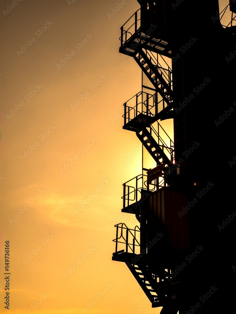 Silhouette fixed ladder in Industrial walkway for crane driver and inspector