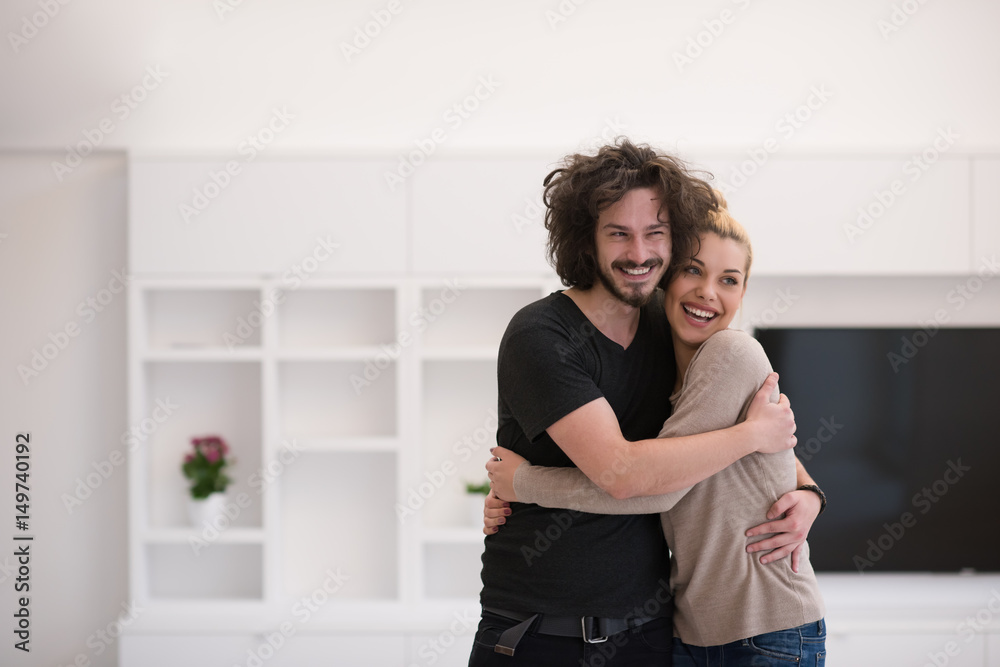 couple hugging in their new home couple hugging in their new home
