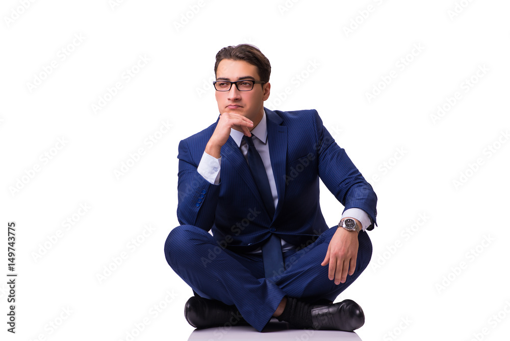 Businessman sitting on the floor isolated on white Businessman sitting on the floor isolated on white