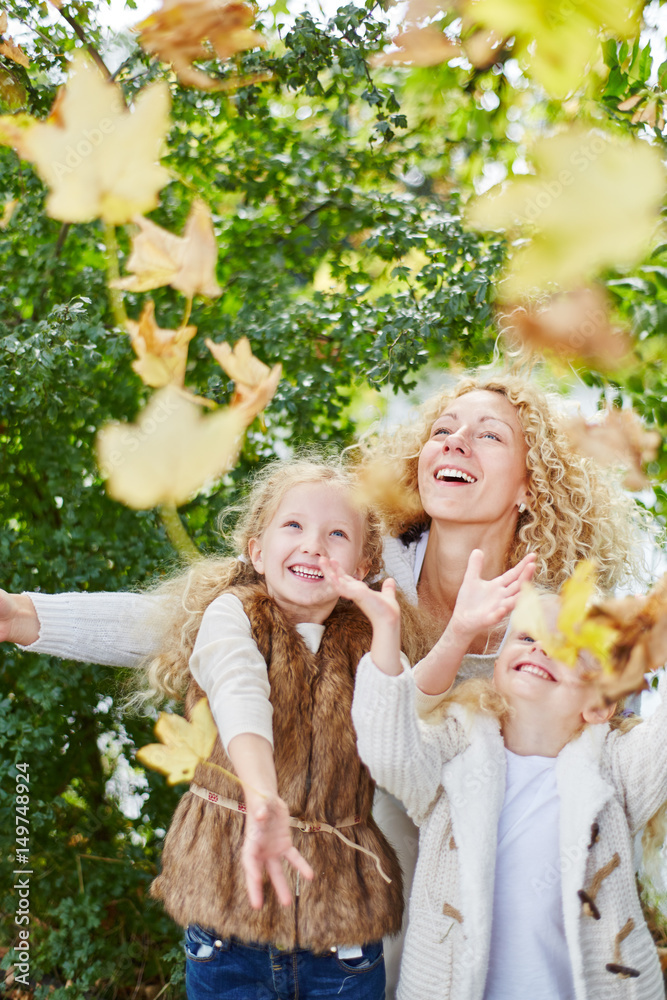 Kids playing with leaves in the park Stock Photo | Adobe Stock