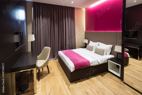Interior of a hotel bedroom with bathroom