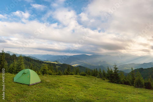 The tent is set on the slopes of the Carpathian Mountains.
