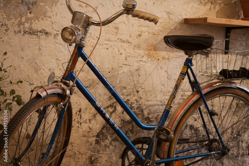 Retro bike parked next to wall