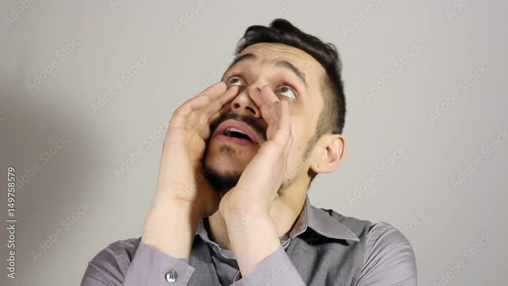 a young bearded man makes a loud statement, gesture a young bearded man makes a loud statement, gesture