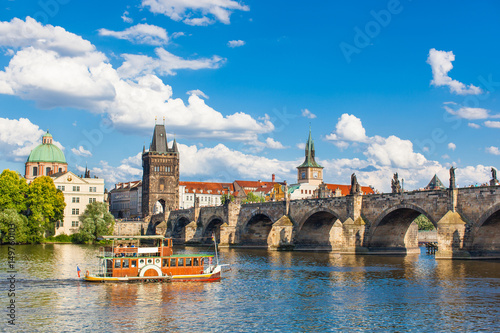 Fényképezés Prague, Czech Republic, Charles Bridge across Vltava river on which the ship sai