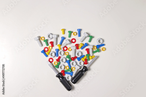 Toys background. Kids construction tools frame on white background. Top view. Flat lay.