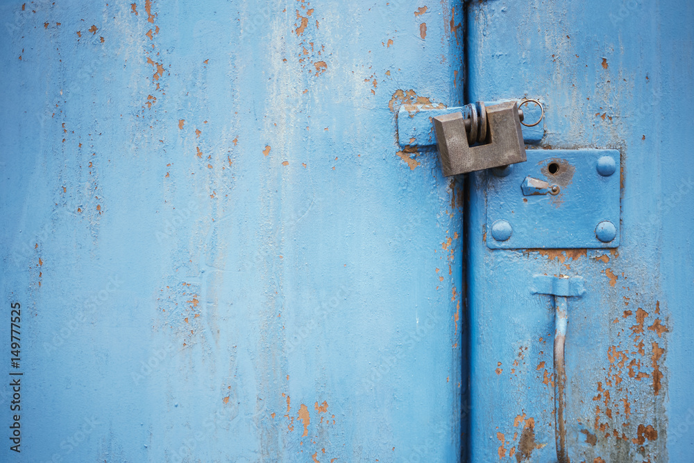 The old door locked with a padlock hanging brackets. Set of backgrounds The old door locked with a padlock hanging brackets. Set of backgrounds
