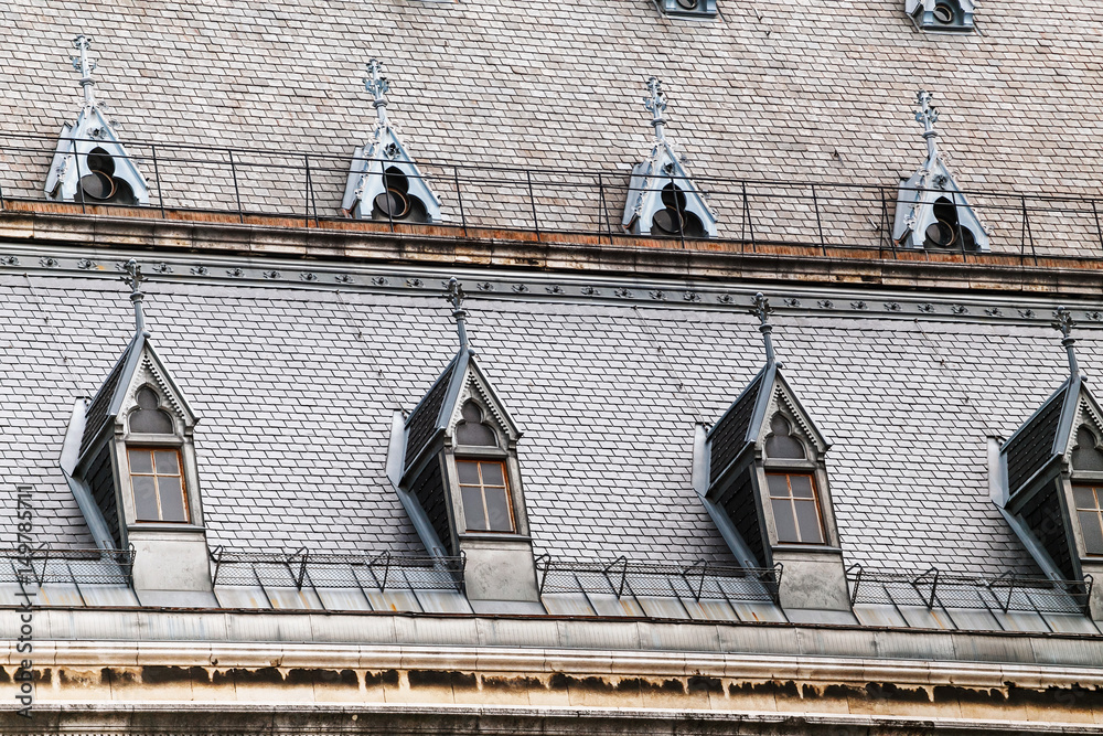 Fototapeta premium Dormer windows on the roofs of gothic building
