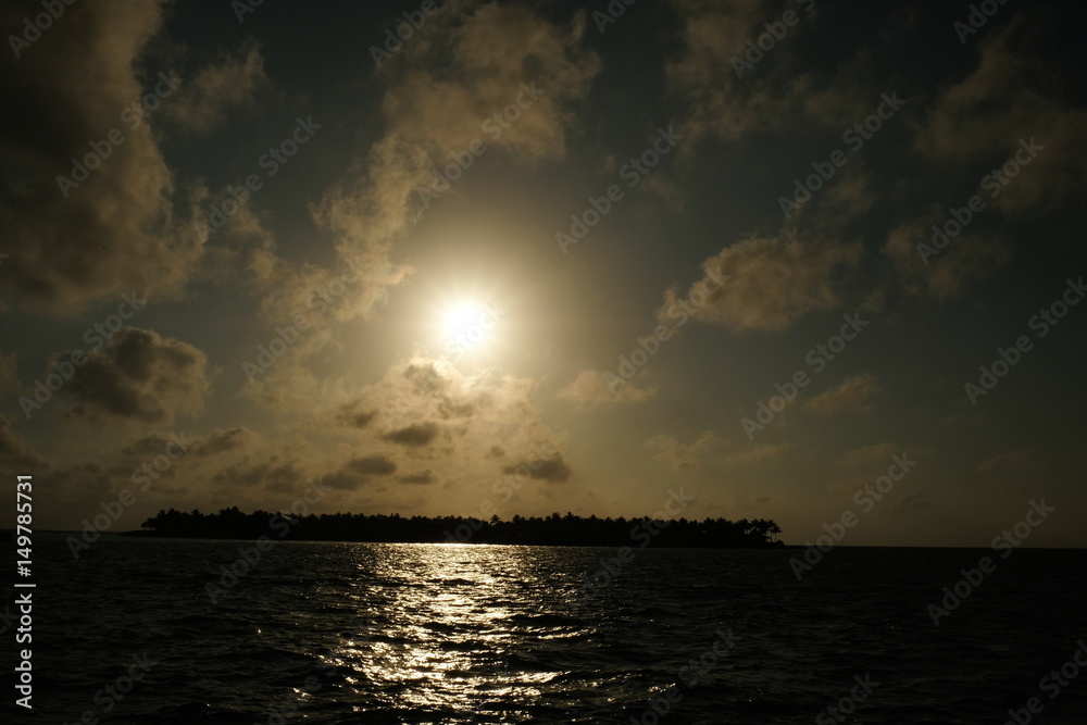 Sunset behind an island