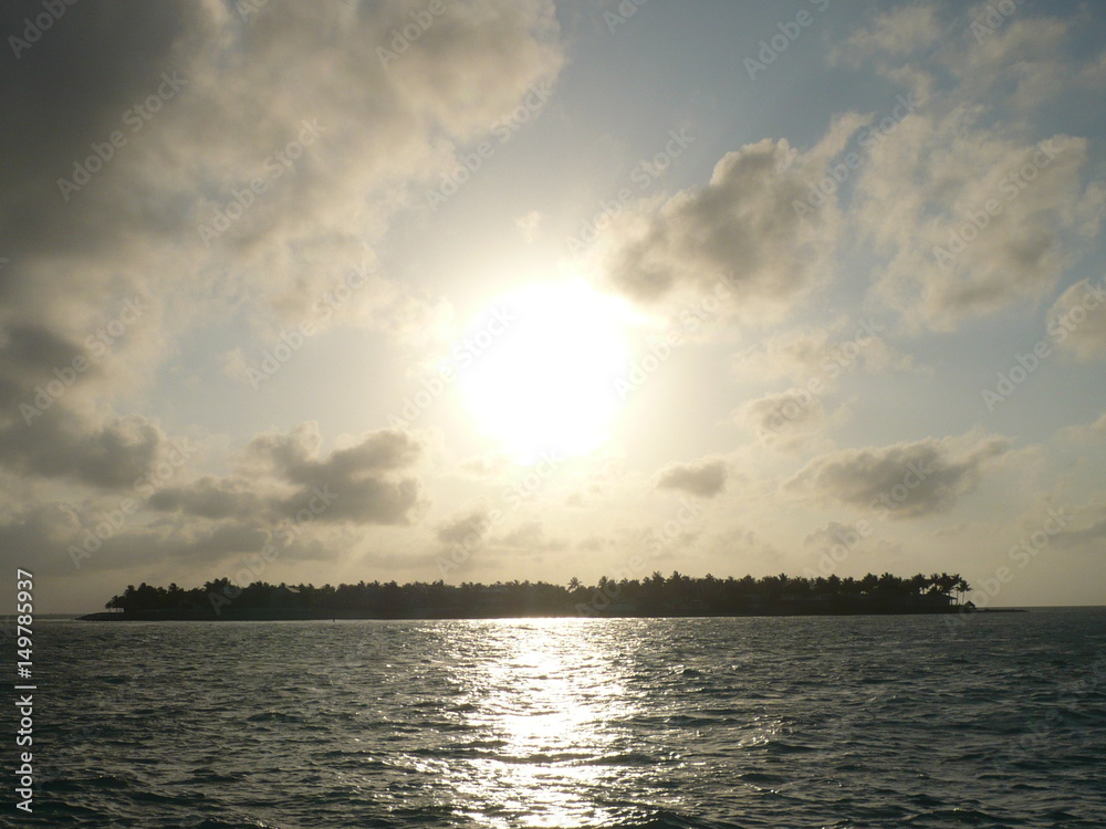 Sunset behind an island